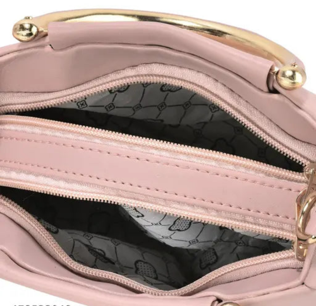 Designer Handbag with Gold Accents and Detachable Strap